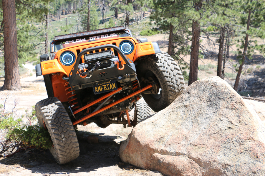 Jeep offroading a rock