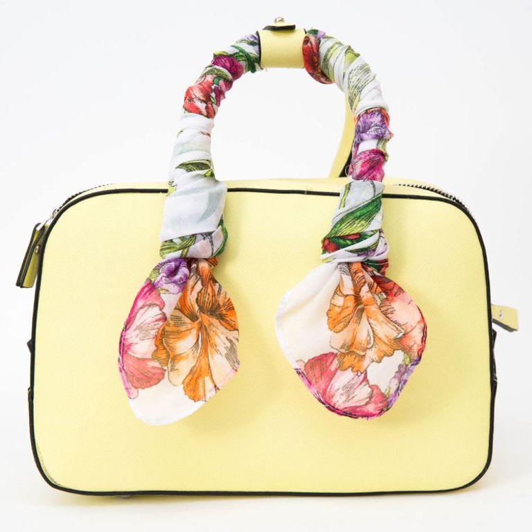 Wrap a printed scarf around the handles of the purse