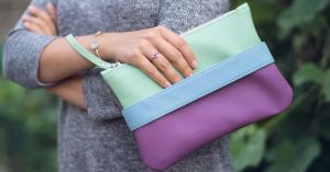 woman holding a clutch